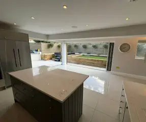 Kitchen extension with island and bi-fold doors to the garden