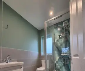 Modern shower room with walk-in enclosure and floating vanity unit